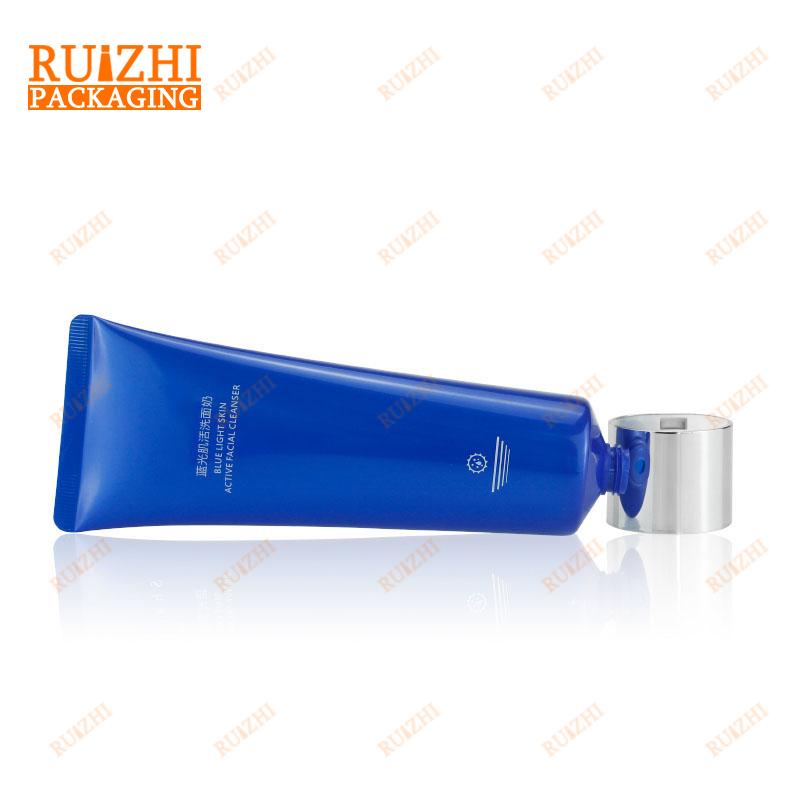 Cosmetic tube with disc cap}